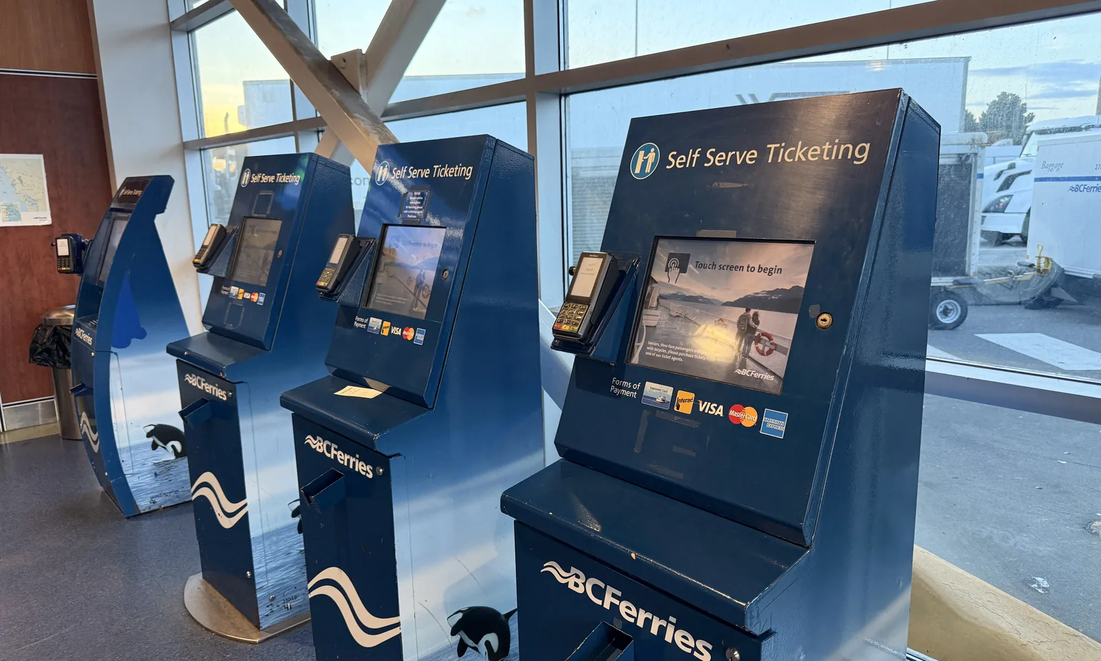 Row of self-serve ticketing kiosks inside the Tsawwassen Ferry Terminal foot-passenger building
