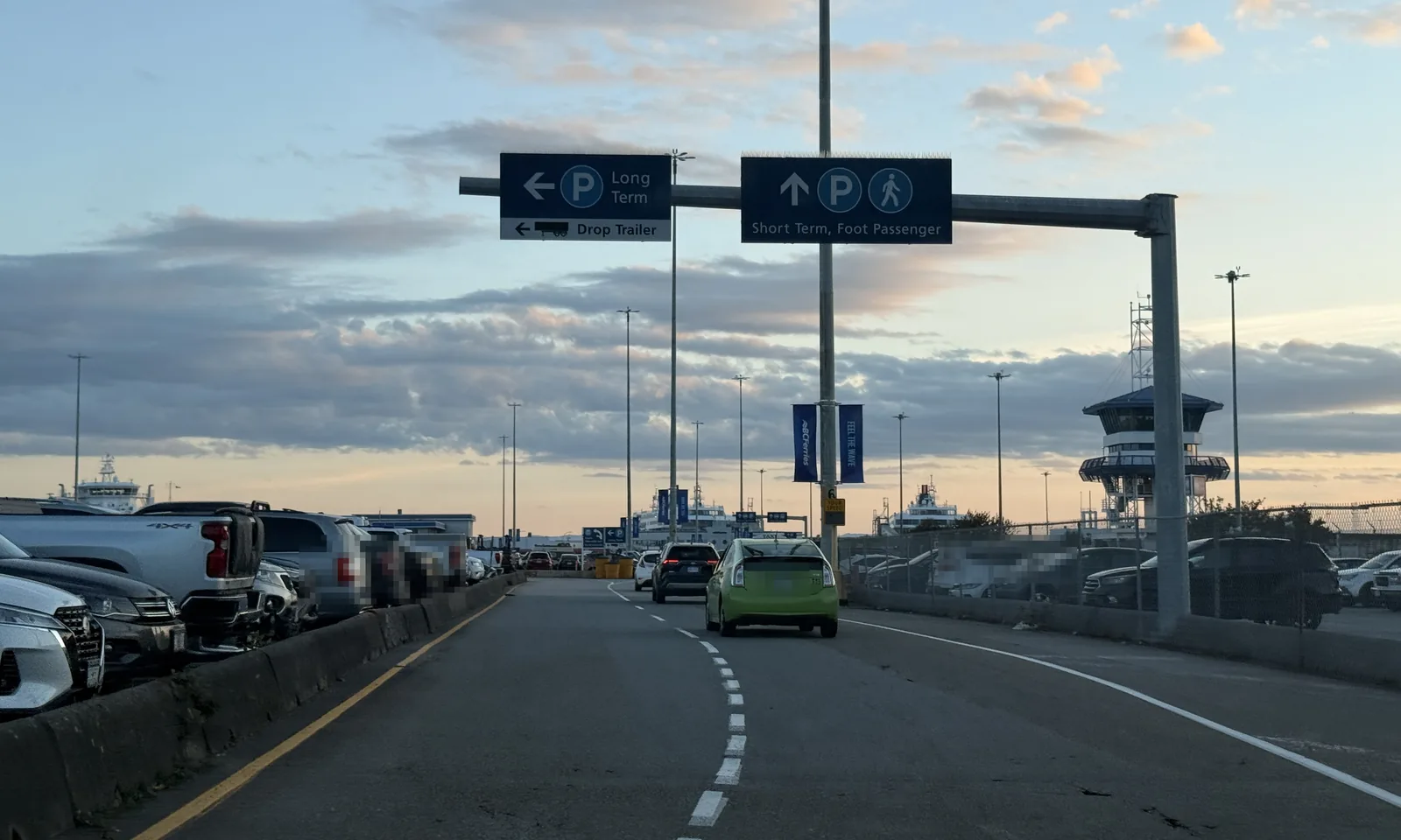 Overhead signs at the end of the Tsawwassen causeway: Long Term parking to the left, Short Term and Foot Passenger straight ahead
