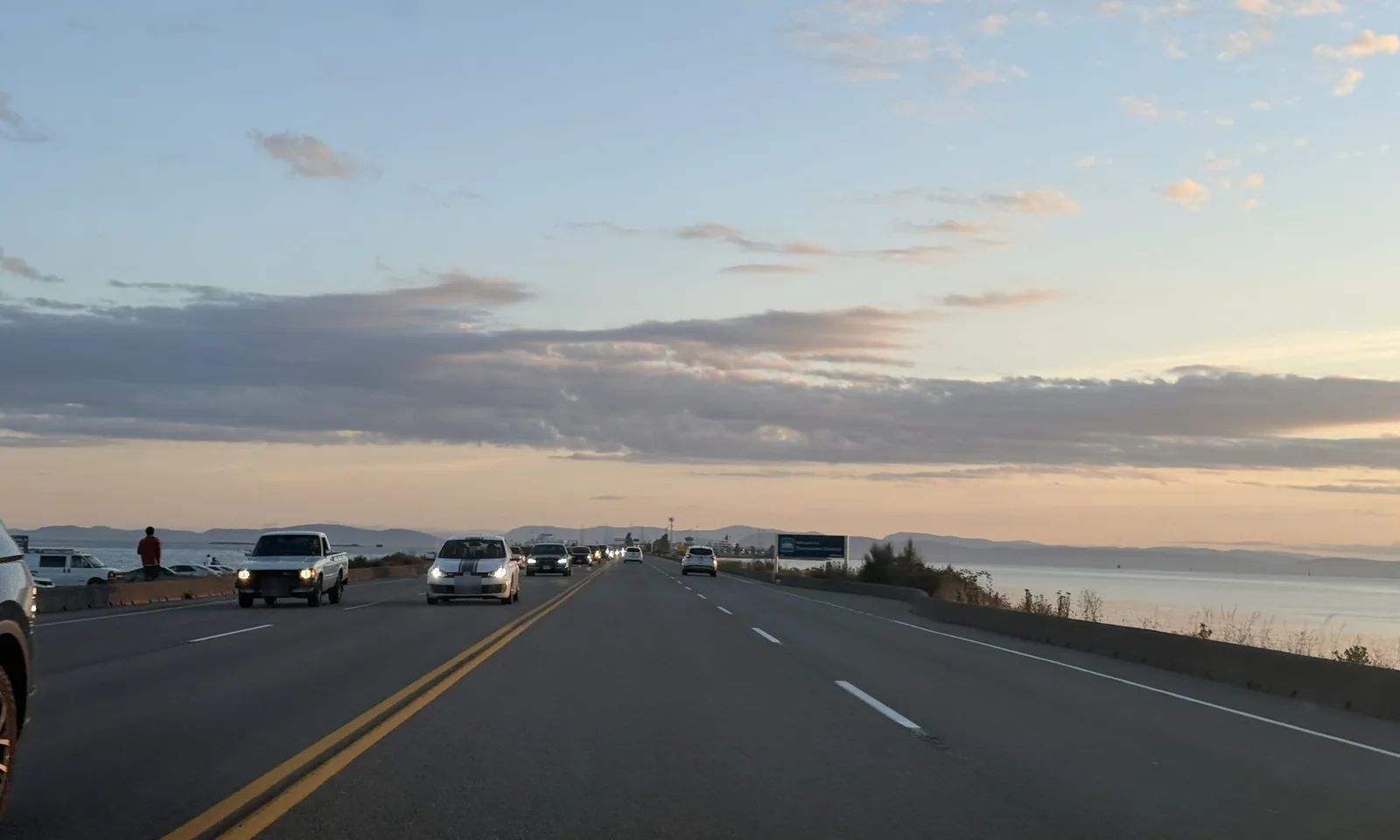 Evening traffic on the Tsawwassen causeway with the ferry terminal visible at the far end